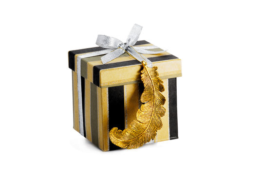 closed box for presents decorated with silver ribbon and golden