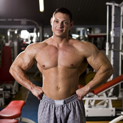 bodybuilder posing at gym