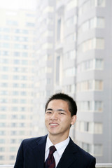 young asian businessman on the balcony