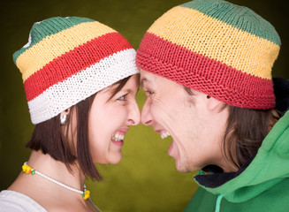 Positive pair in reggae hats that  scream together