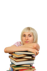Young woman with stack of books isolated on white