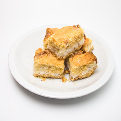 closeup of pieces of coconut cake isolated on white