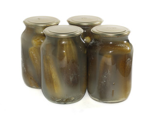 cans of cucumbers isolated on white.