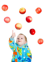 Fototapeta na wymiar Little baby girl caughts apple