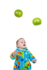 Fototapeta premium Little baby girl caughts fruits -grapefruit