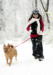 Woman running with dog