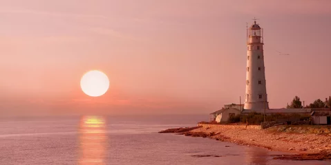 Gordijnen lighthouse and sunset © Alexander Ozerov