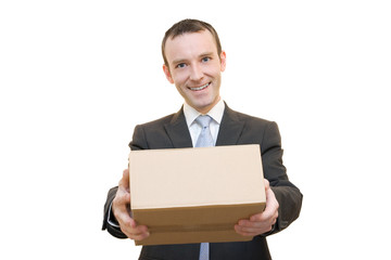 Smiling man giving a brown cardboard box
