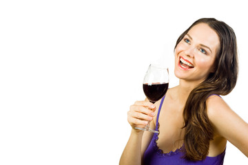 Beautiful young woman laughing and holding a glass of red wine