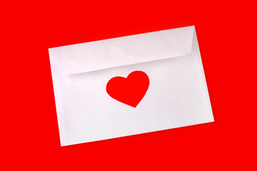Envelop with red heart on red background