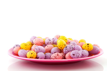Pink plate filled with easter eggs
