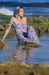 Young lady relaxing in the seawater