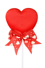 Valentines red heart on a stick with red ribbon, isolated