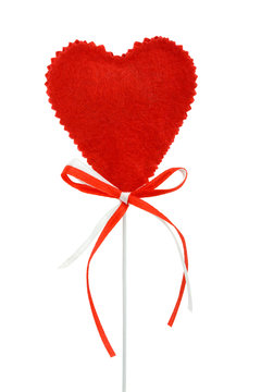 Valentines heart on a stick with red and white ribbons, isolated