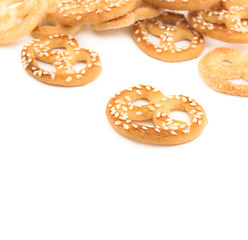 Knot-shaped biscuit with sugar and sesame