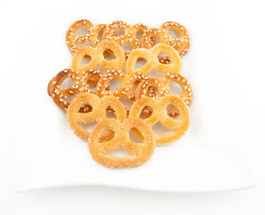 Knot-shaped biscuit with sugar and sesame