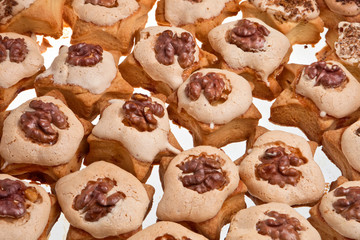 Christmas cookies with nuts over white background.