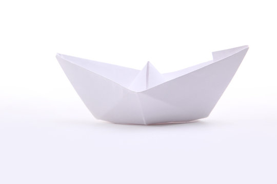 Three paper ships isolated on white