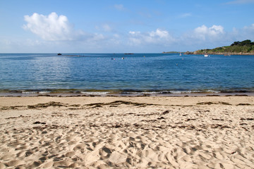 Porthcressa beach and a calm sea, Isles of Scilly, Cornwall UK.