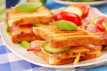 toasts with cheese,bacon and tomato