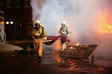 Firefighters carrying an accident victim