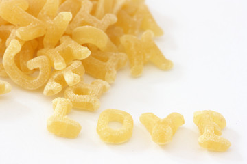 Pasta noodles in alphabet shapes forming word love