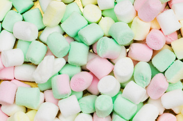 Various dry colourful sweets arranged as background