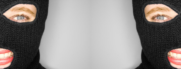 A stock photograph of an attractive woman wearing a balaclava.