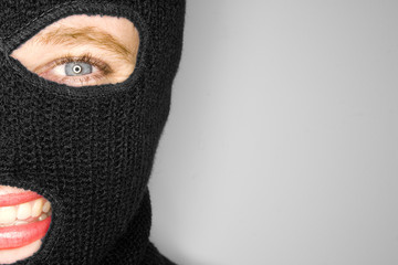 A stock photograph of an attractive woman wearing a balaclava.