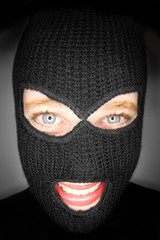 A stock photograph of an attractive woman wearing a balaclava.