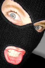 A stock photograph of an attractive woman wearing a balaclava.