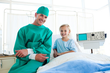 Surgeon explaining a surgery to a little girl