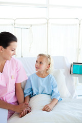 Fototapeta premium A nurse looking after a little girl