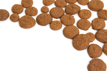 Home baked pepernoten cookies over white background