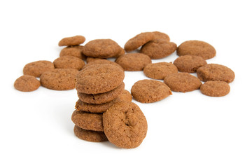 Home baked pepernoten cookies over white background