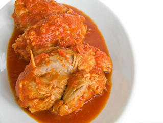 Meat roulade with tomato sauce on plate