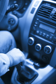 the interior of a car. man driving on the road.