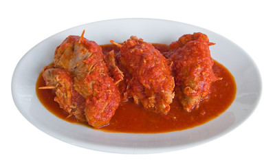 Meat roulade with tomato sauce on plate