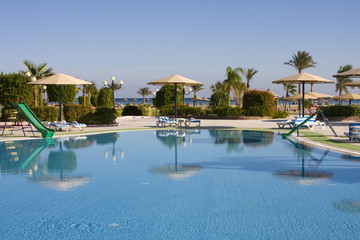 Swimming pool on a sunny day. Hurghada city in Egypt.