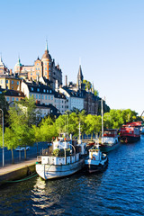 Old city buildings and boats on water