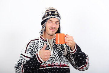 young beautiful winter man with hot tea cup