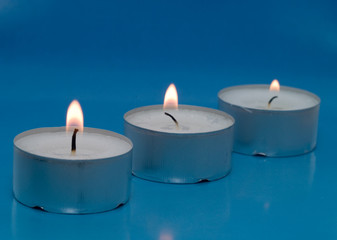 Fototapeta na wymiar Closeup of burning candles