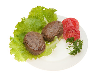 Cutlets with vegetables on a plate