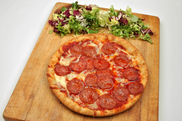 home made italian pizza with salami and cheese