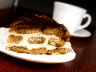 Sweet cake with cup of coffee