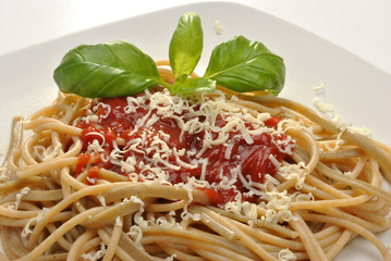 home made spaghetti with tomato sauce and basil