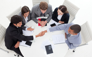 Successful international business people shaking hands