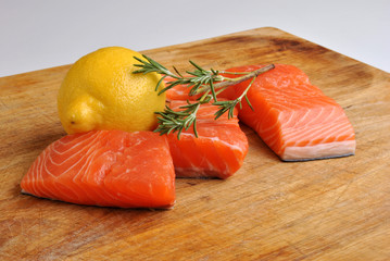 raw organic wild salmon steak with lemon