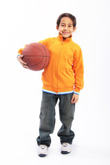 Young boy holding basketball isolated