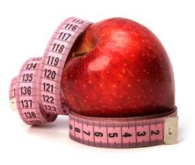 tape measure wrapped around the apple isolated on white backgro